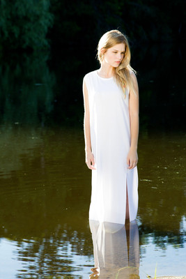 Young model pose in lake